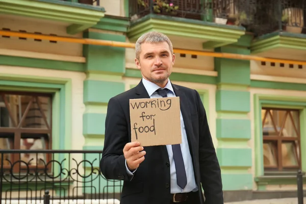 Businessman Holding Piece Cardboard Text Working Food Outdoors — Stock Photo, Image