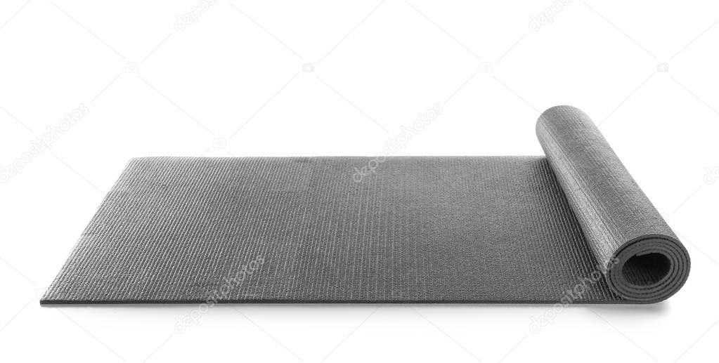 Black yoga mat on white background