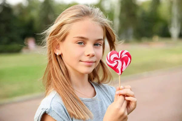 Cute Little Girl Heart Shaped Lollipop Outdoors — Stock Photo, Image