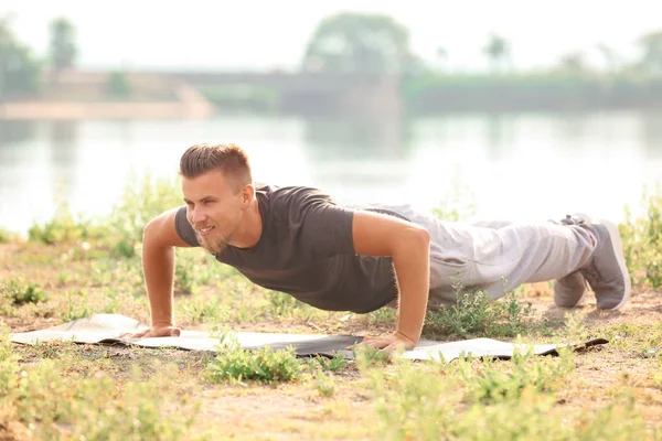 Sporty Young Man Training Outdoors River — Stock Photo, Image