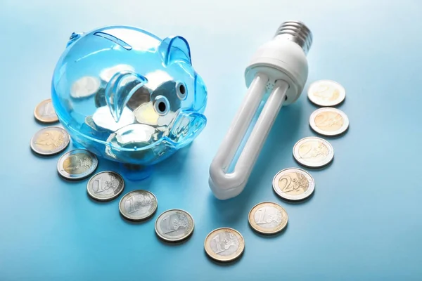 Piggy Bank Coins Light Bulb Color Background Electricity Saving Concept — Stock Photo, Image