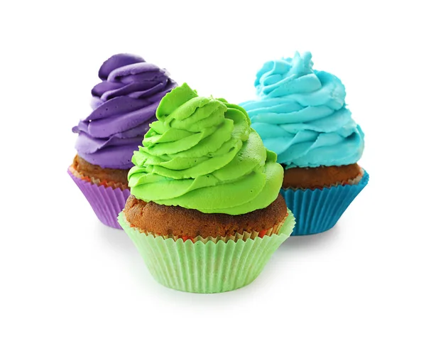 Delicious colorful cupcakes on white background