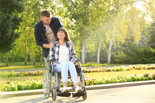 Young Woman Wheelchair Her Husband Outdoors — Stock Photo, Image