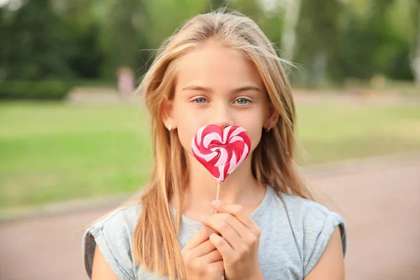 Cute Little Girl Heart Shaped Lollipop Outdoors — Stock Photo, Image