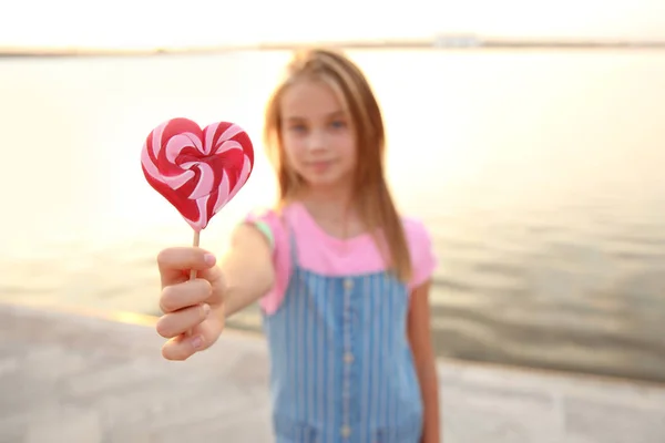 Cute Little Girl Heart Shaped Lollipop River — Stock Photo, Image