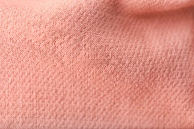 Arka plan olarak pembe kumaş dokusuna