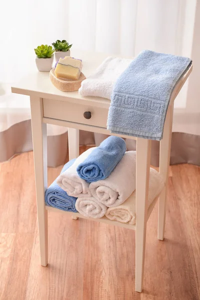 Clean towels and soap on table