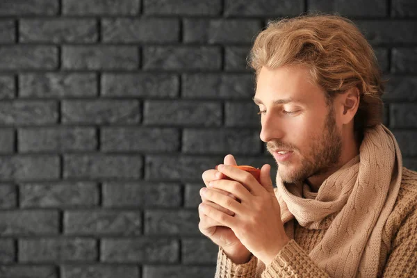 Man Drinking Delicious Mulled Wine Dark Brick Wall — Stock Photo, Image