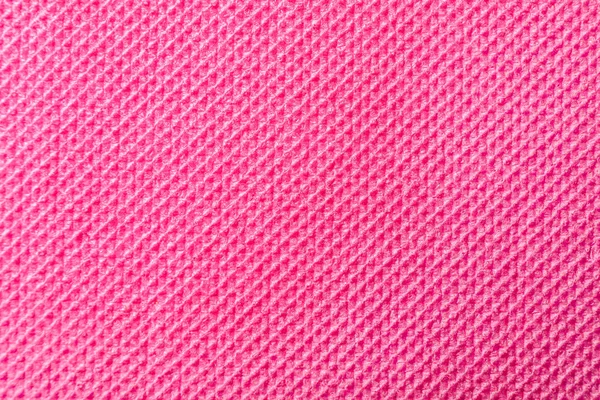 ピンクの背景としてのヨガ マット テクスチャ — ストック写真