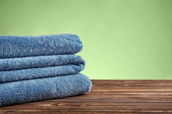 Stack Clean Soft Towels Wooden Table Color Background — Stock Photo, Image