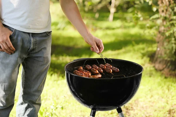 Man Cooking Sausages Barbecue Grill Outdoors — Stock Photo, Image