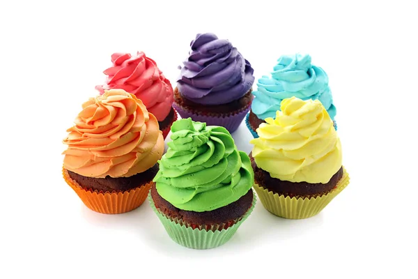 Delicious colorful cupcakes on white background