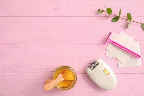 Set for hair removing on color wooden table