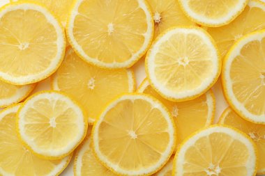 Arka plan, üstten görünüm olarak taze sulu limon dilimleri