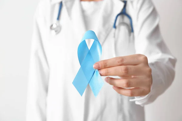 Female Doctor Holding Blue Ribbon Closeup Cancer Awareness Concept — Stock Photo, Image