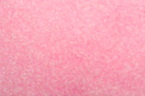 Blurred view of shiny pink sequins