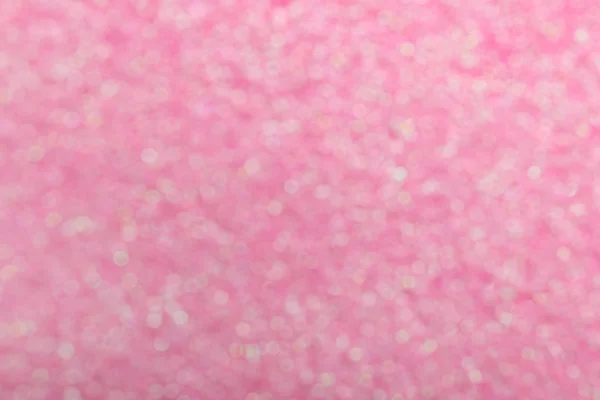 Blurred view of shiny pink sequins