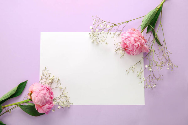 Beautiful flowers and blank card on color background