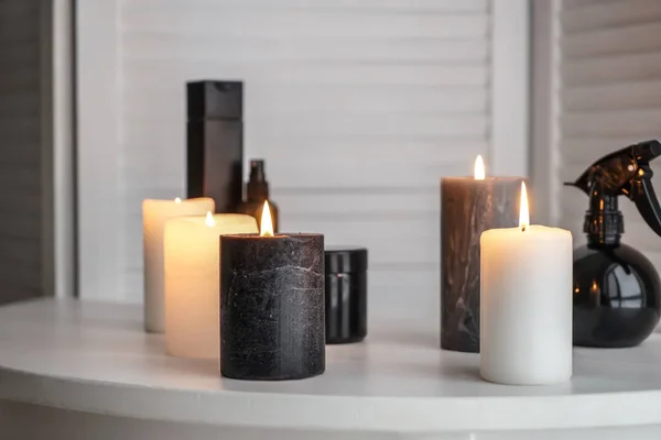 Burning Candles Cosmetics White Table Indoors — Stock Photo, Image