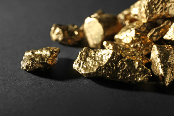 Gold nuggets on black background