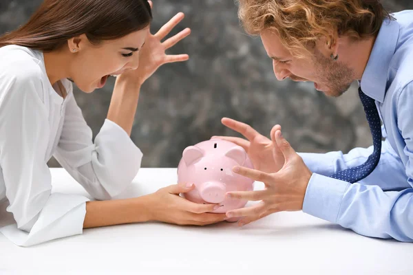 Young Quarreling Couple Piggy Bank Table — Stock Photo, Image