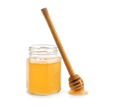 Kavanoz bal beyaz zemin üzerine kepçe ile