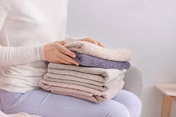 Woman Folding Clean Soft Towels Sofa Home — Stock Photo, Image