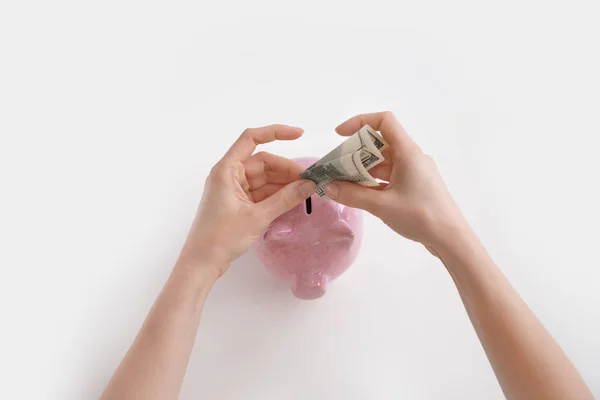Woman Putting Banknotes Piggy Bank White Background — Stock Photo, Image