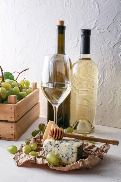 Bottles Wine Ripe Grapes Cheese White Table — Stock Photo, Image