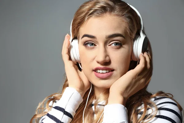 Beautiful Young Woman Listening Music Grey Background — Stock Photo, Image