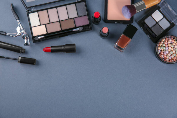 Flat lay composition with professional cosmetics on grey background