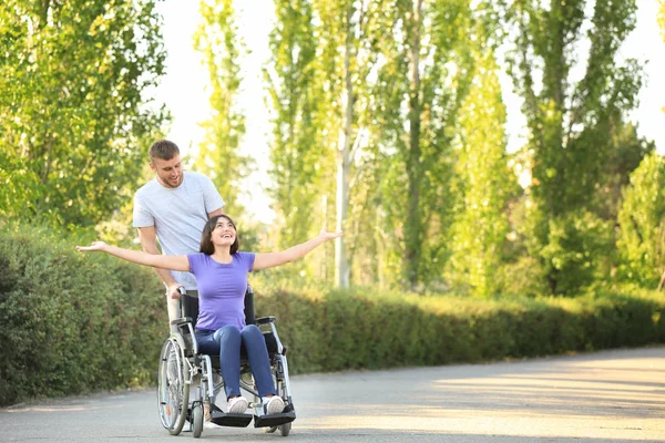 Happy Young Woman Wheelchair Her Husband Outdoors — Stock Photo, Image