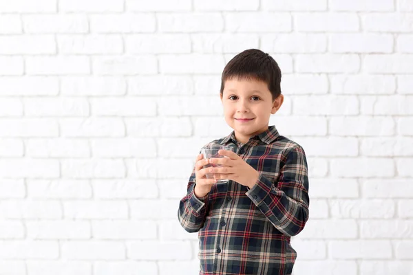 Little Boy Holding Glass Fresh Water Brick Wall — Stock Photo, Image