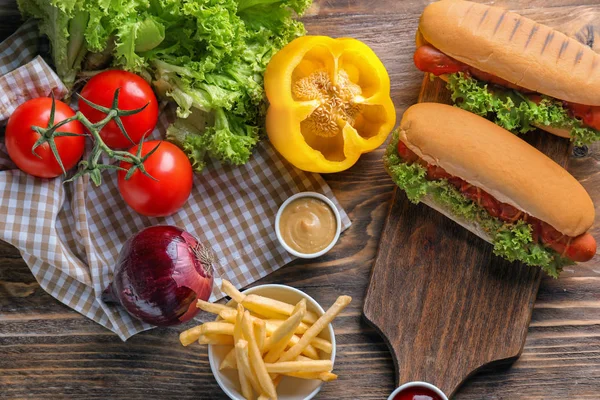 Composition Vegetables Tasty Hot Dogs Wooden Table — Stock Photo, Image