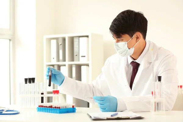 Male Doctor Working Blood Samples Table Laboratory Stock Photo