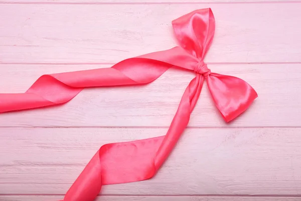 Curled Pink Ribbon Bow Color Wooden Background — Stock Photo, Image