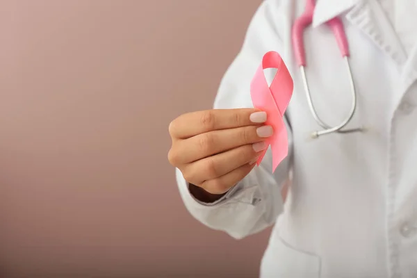 Female Doctor Holding Pink Ribbon Color Background Closeup Breast Cancer — Stock Photo, Image