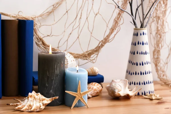 Books Burning Candles Seashells Table — Stock Photo, Image