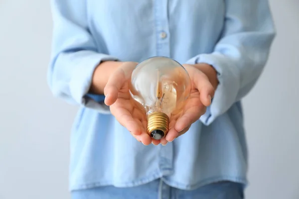 Woman Eco Light Bulb Light Background Closeup — Stock Photo, Image