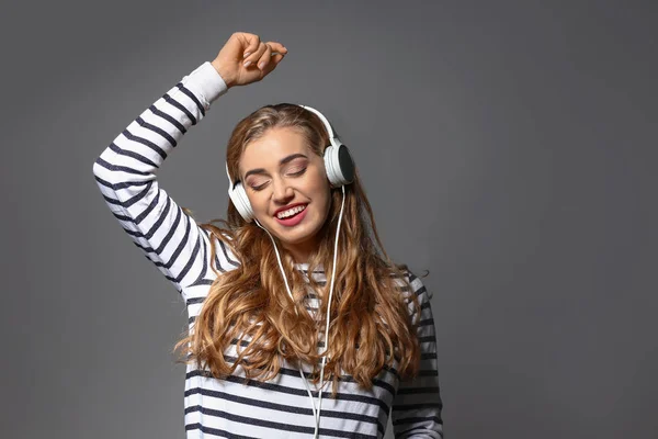 Beautiful Young Woman Listening Music Grey Background — Stock Photo, Image