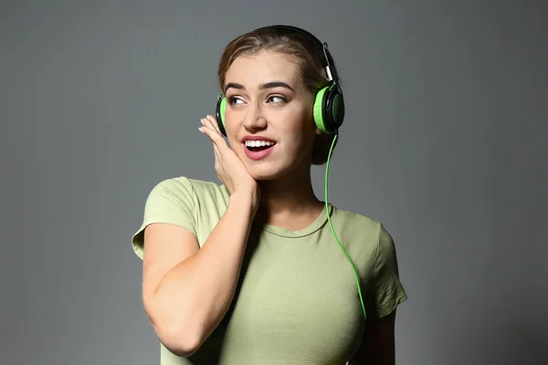 Beautiful Young Woman Listening Music Grey Background — Stock Photo, Image