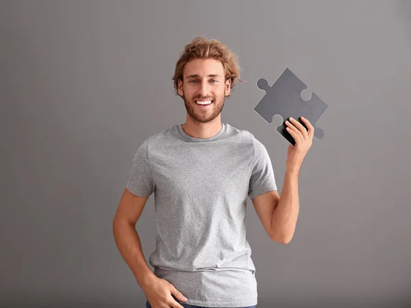 Young Man Piece Jigsaw Puzzle Grey Background — Stock Photo, Image