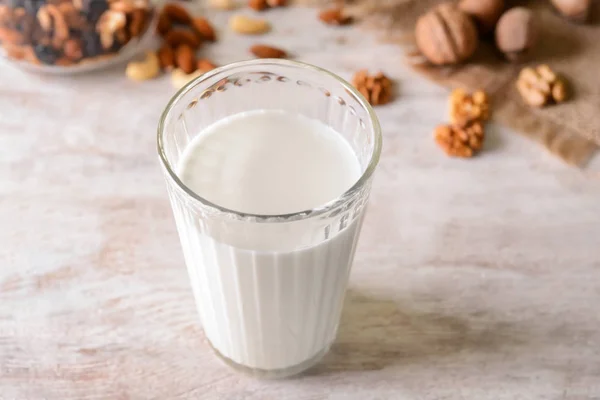 Glass Tasty Milk Nuts Light Table — Stock Photo, Image