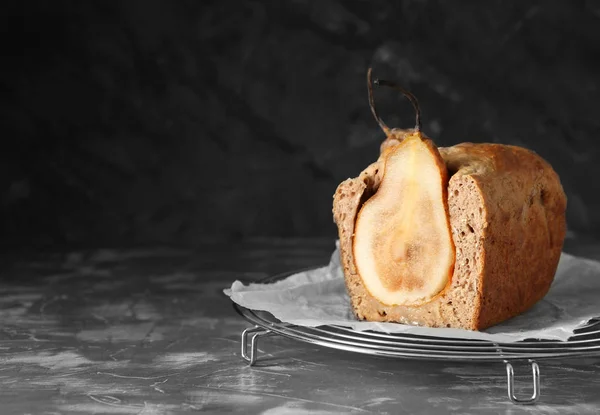 Sweet cut pear pie on dark background