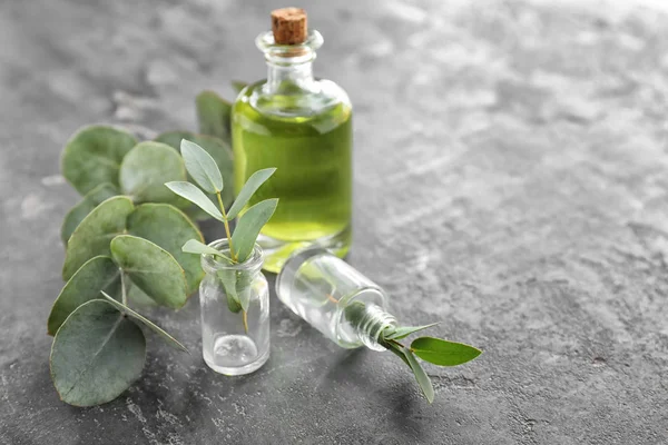 Bottles Essential Oil Eucalyptus Branches Table — Stock Photo, Image