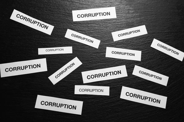 Pieces Paper Words Corruption Black Background — Stock Photo, Image