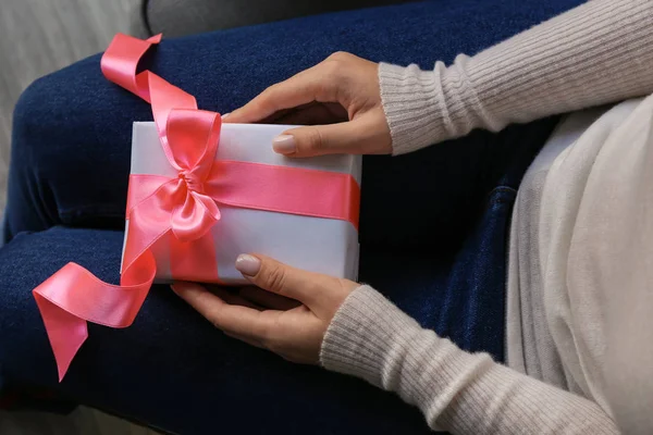 Woman Holding Gift Box Pink Ribbon Home — Stock Photo, Image