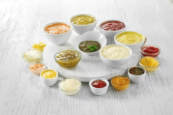 Different Tasty Sauces Bowls White Wooden Table — Stock Photo, Image