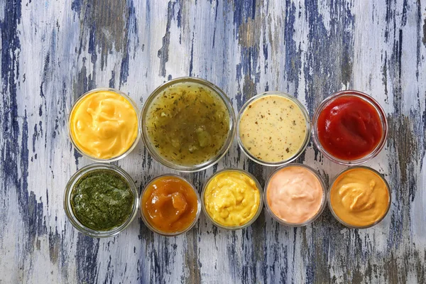 Different Tasty Sauces Bowls Wooden Table — Stock Photo, Image