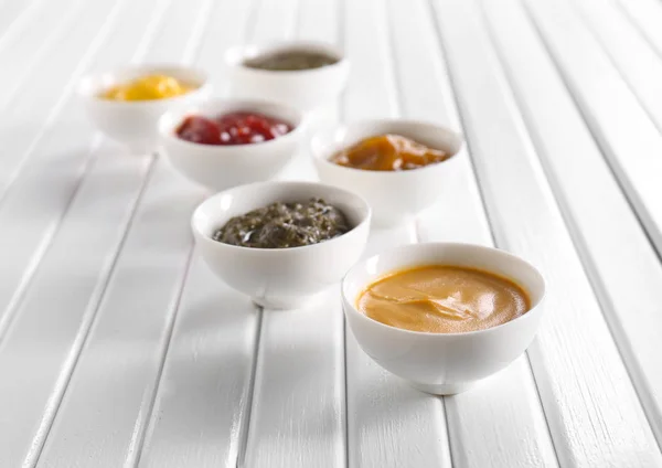 Different Tasty Sauces Bowls White Wooden Table — Stock Photo, Image